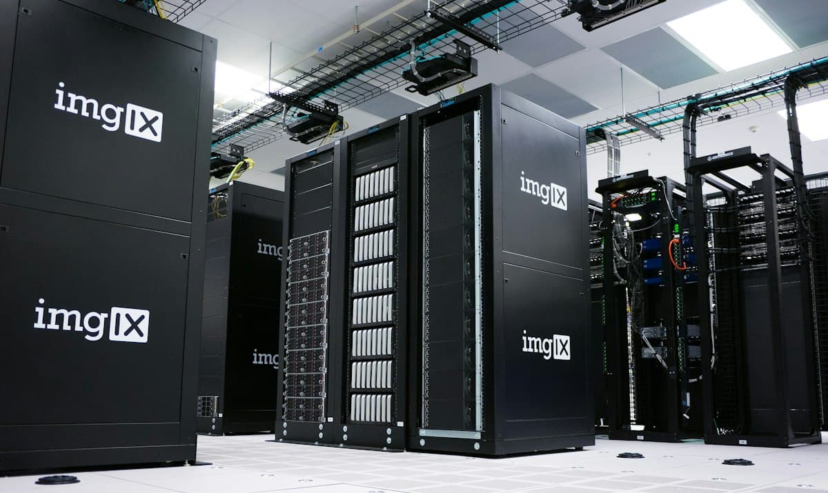 Rows of black server racks in a data center