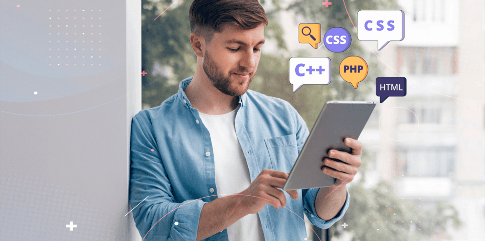 Man looking at his tablet, with a lot of languages illustrations, symbolizing the best web development languages.